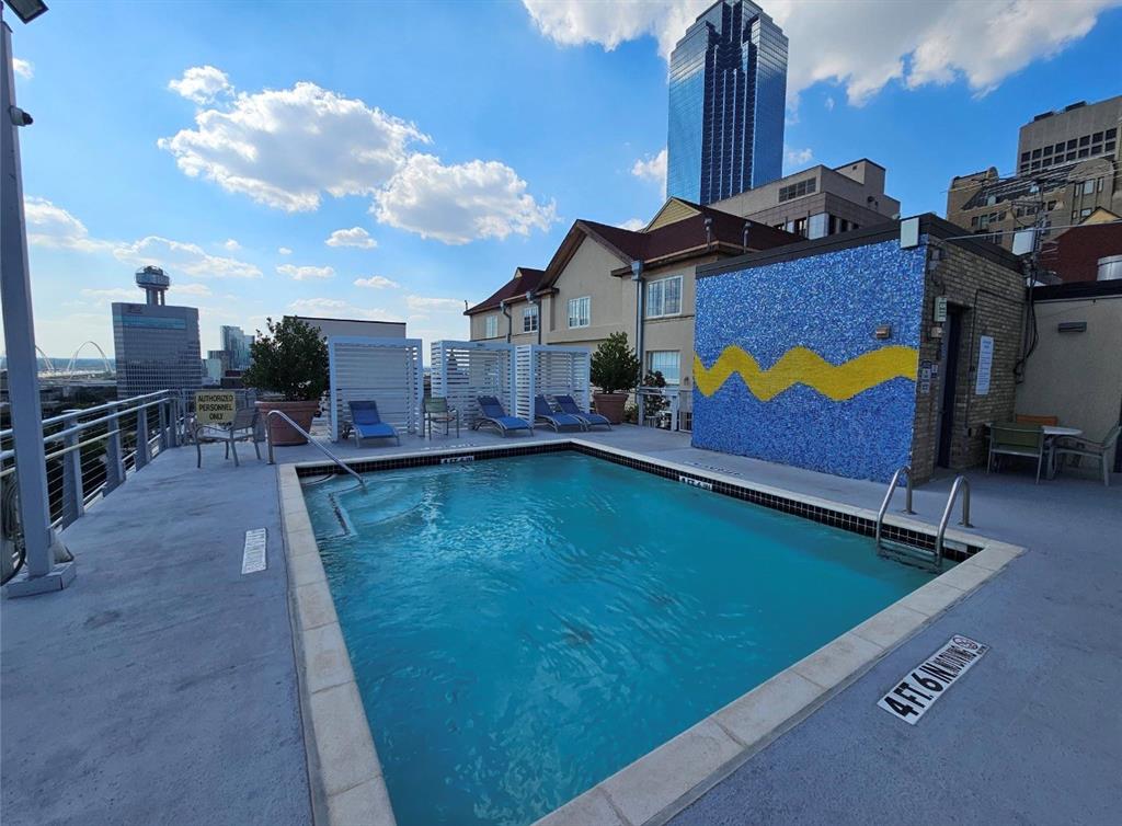 1122 Jackson Street, Unit 618 Dallas, TX 75202 - Photo 16 of 17 a swimming pool with outdoor seating