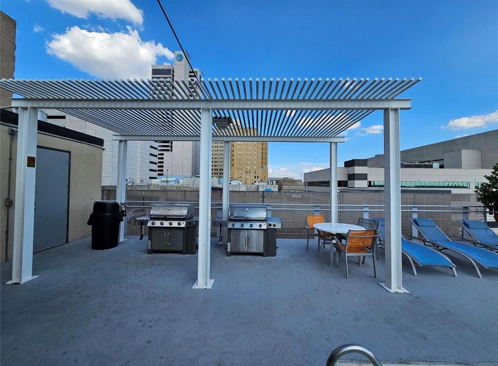 1122 Jackson Street, Unit 618 Dallas, TX 75202 - Photo 17 of 17 a view of a livingroom with furniture and floor to ceiling window