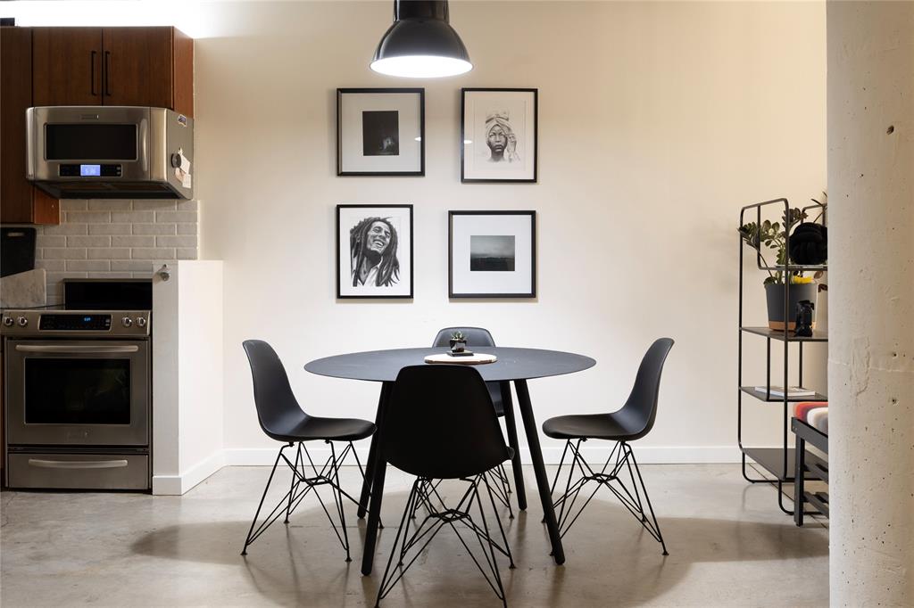 1122 Jackson Street, Unit 618 Dallas, TX 75202 - Photo 3 of 17 a view of a dining room with furniture and a flat screen tv
