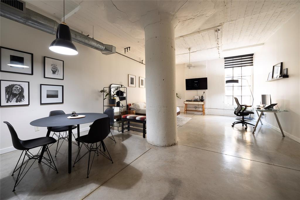1122 Jackson Street, Unit 618 Dallas, TX 75202 - Photo 4 of 17 a living room with furniture a rug and a flat screen tv