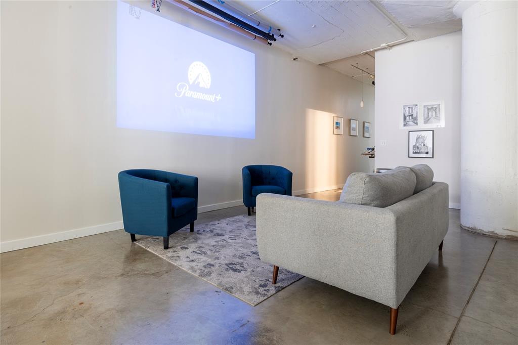 1122 Jackson Street, Unit 618 Dallas, TX 75202 - Photo 9 of 17 a living room with furniture and a chair