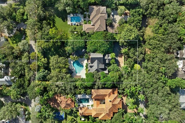 an aerial view of house with yard