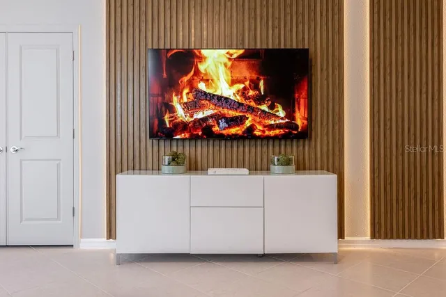 a view of a room with furniture and a window