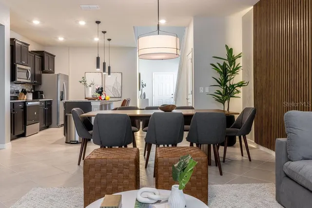 a living room with furniture and a lamp