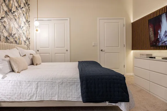 a bedroom with a bed and window