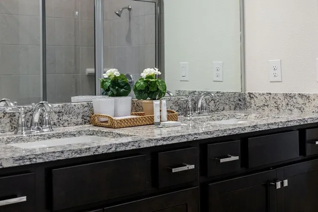 a bedroom with a bed and a dresser in it