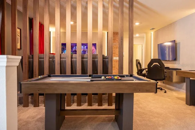a bathroom with a granite countertop bathtub sink and mirror