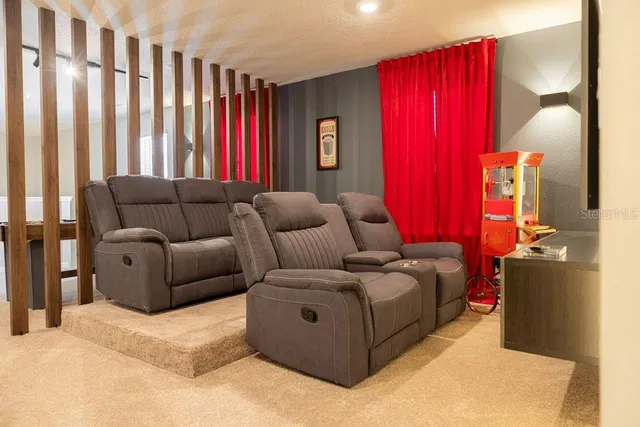 a bedroom with a bed and a night stand