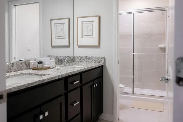 a view of a balcony with chairs and wooden floor