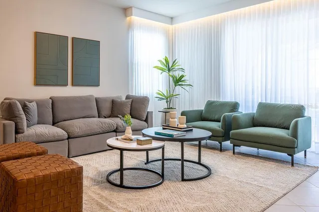 a kitchen with stainless steel appliances granite countertop a refrigerator a stove and a sink