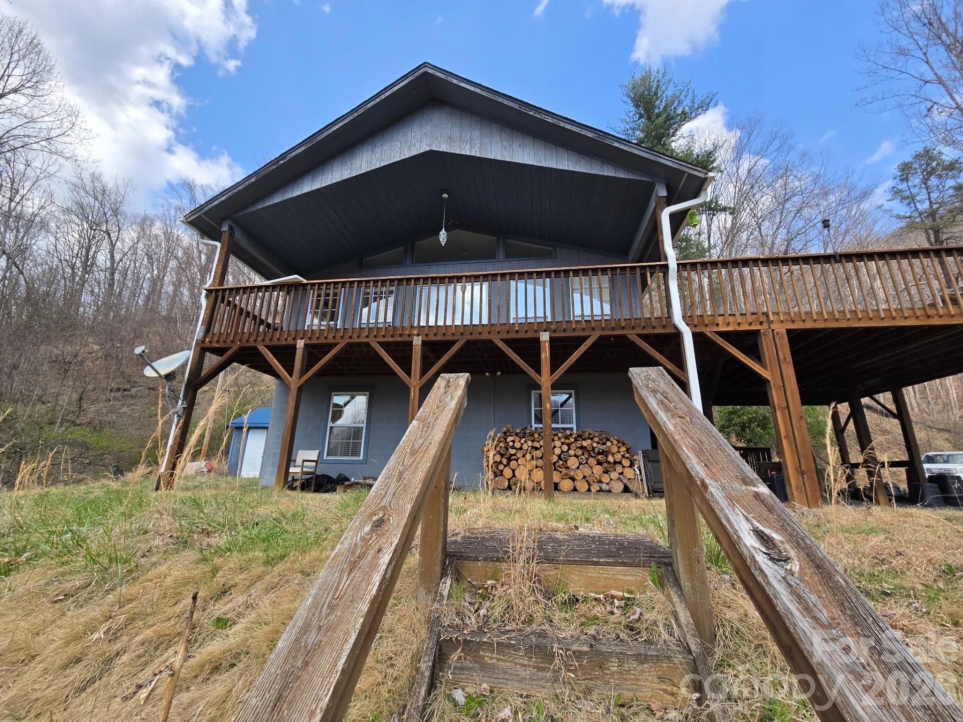 987 W Road Hot Springs, NC 28743 - Photo 2 of 10 a view of a house with a balcony