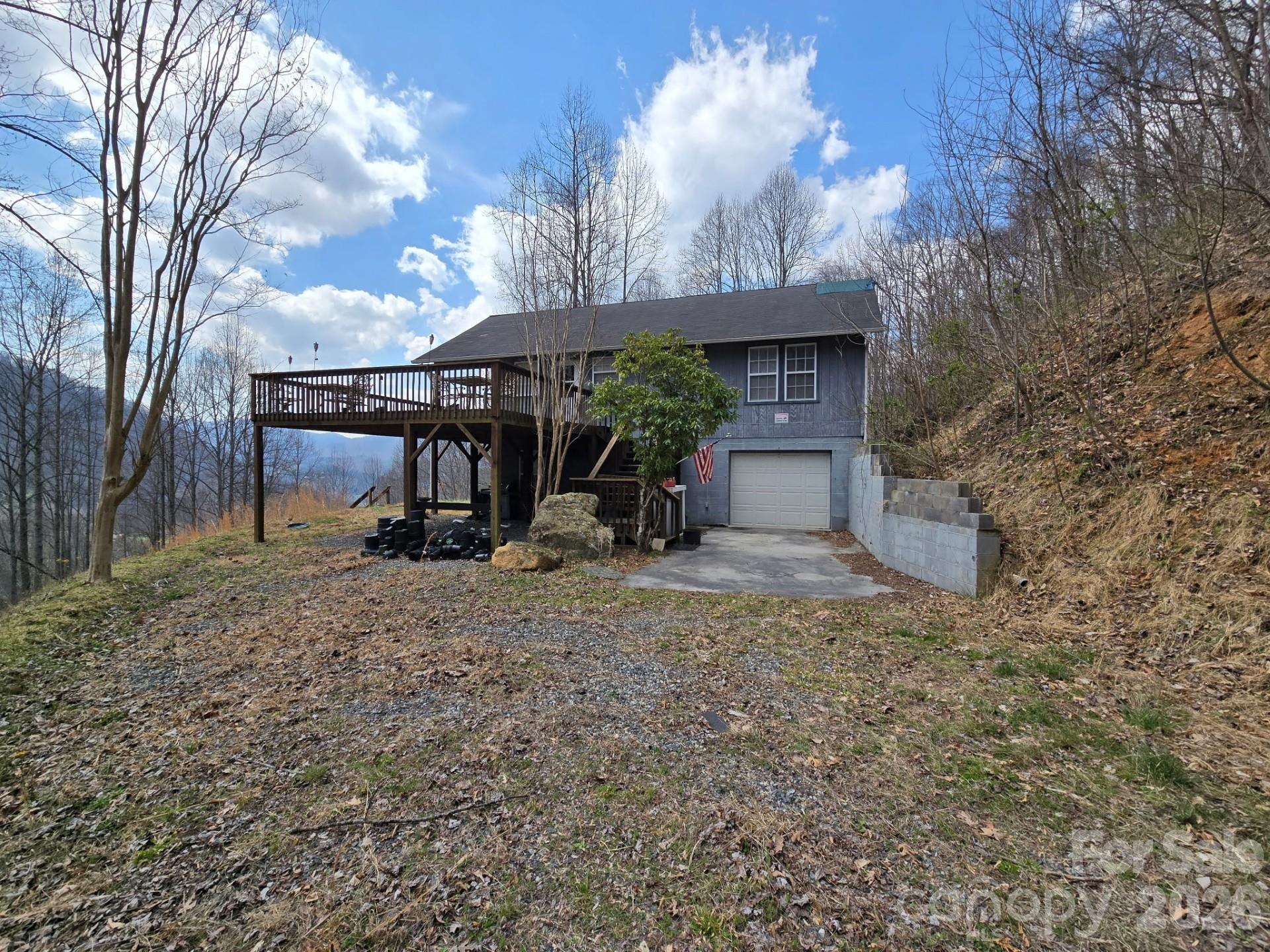 987 W Road Hot Springs, NC 28743 - Photo 3 of 10 a view of a house with a backyard and a tree