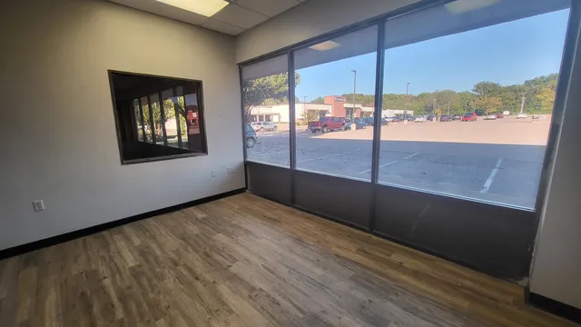 a view of an empty room with a window