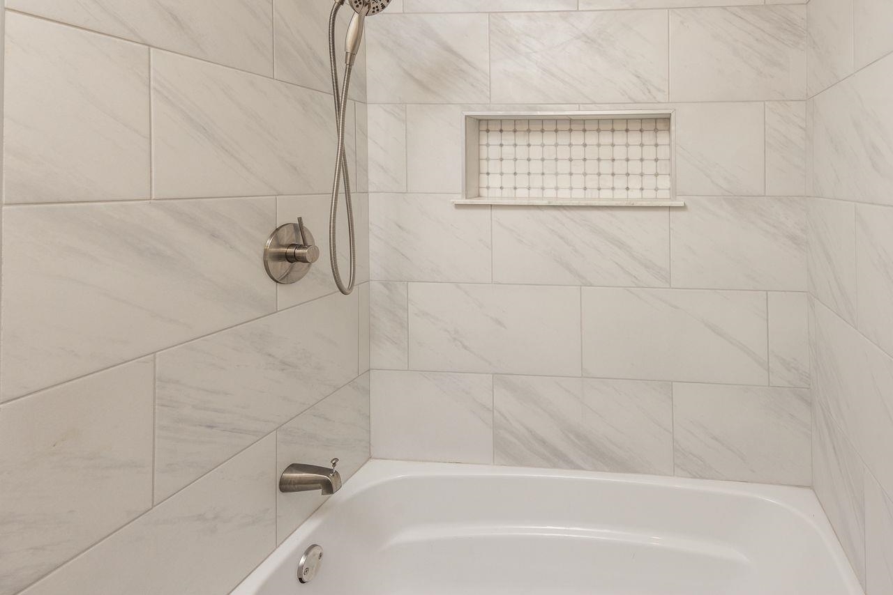 1243 Dearing Road Memphis, TN 38117 - Photo 16 of 25 a bathroom with a bathtub and shower