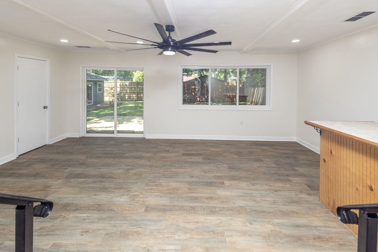1243 Dearing Road Memphis, TN 38117 - Photo 19 of 25 an empty room with wooden floor fan and windows