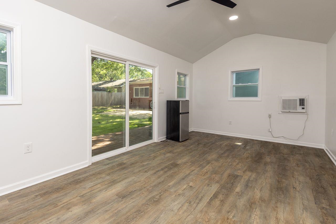 1243 Dearing Road Memphis, TN 38117 - Photo 20 of 25 an empty room with wooden floor and windows