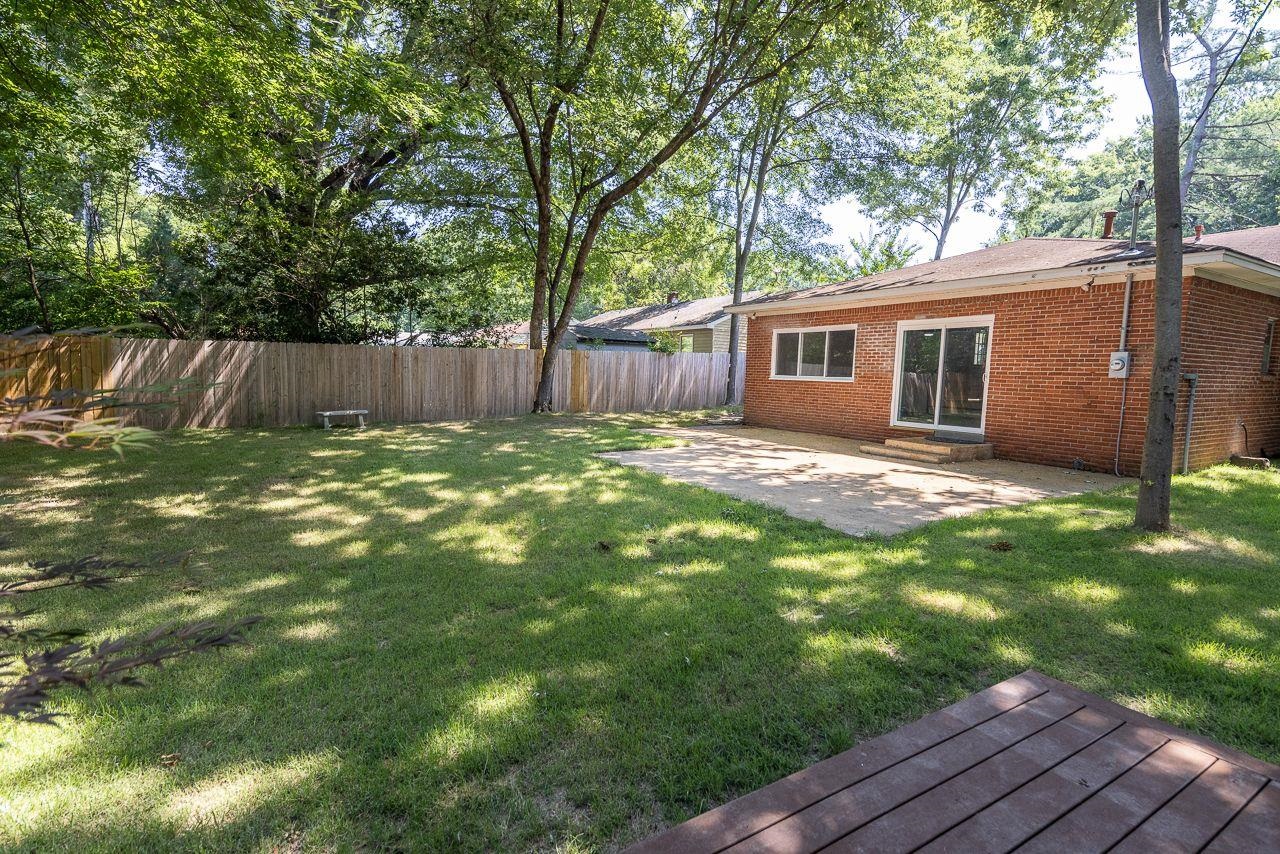 1243 Dearing Road Memphis, TN 38117 - Photo 25 of 25 a view of a backyard with a large tree