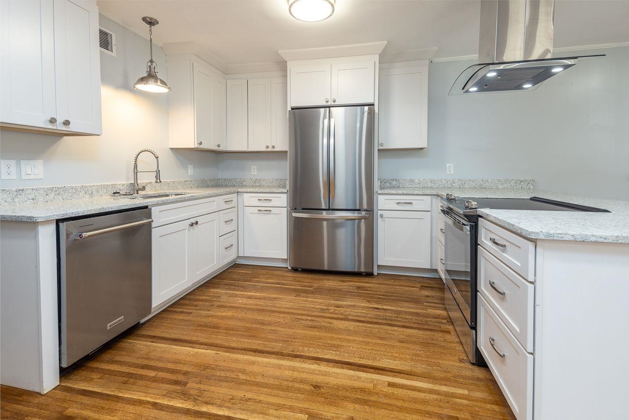 1243 Dearing Road Memphis, TN 38117 - Photo 5 of 25 a kitchen with granite countertop a sink stove and refrigerator