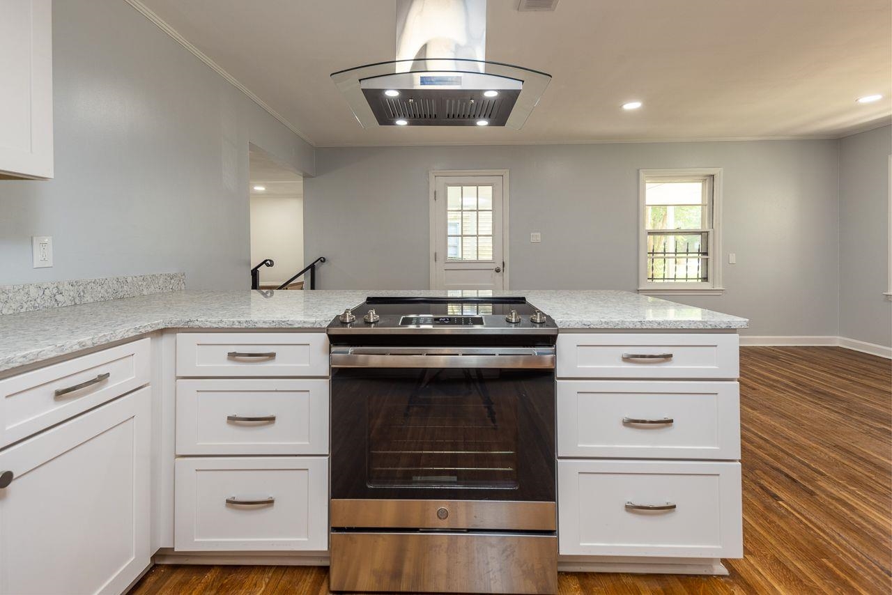 1243 Dearing Road Memphis, TN 38117 - Photo 7 of 25 a kitchen with granite countertop cabinets and window