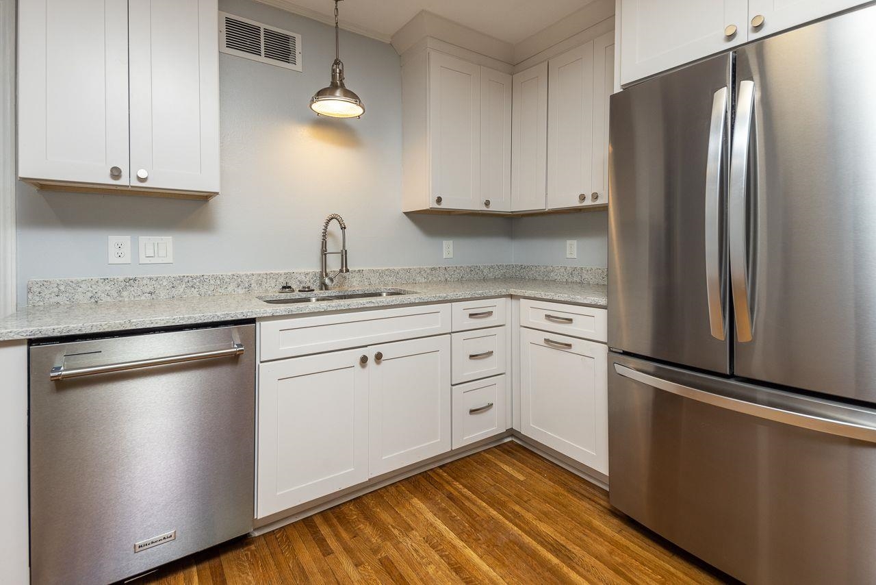 1243 Dearing Road Memphis, TN 38117 - Photo 8 of 25 a kitchen with a refrigerator sink and cabinets