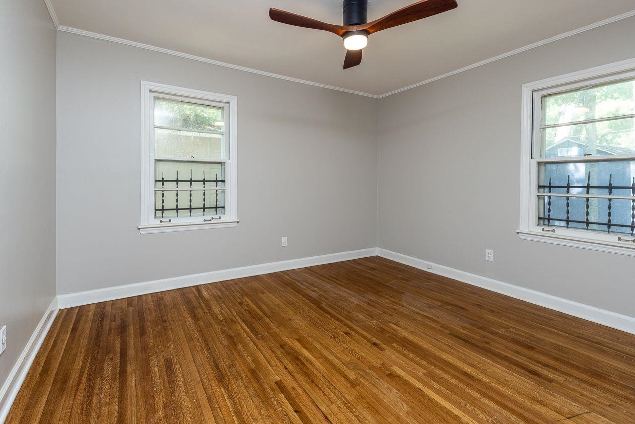 1243 Dearing Road Memphis, TN 38117 - Photo 10 of 25 wooden floor in an empty room with a window