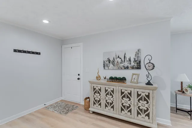 a view of kitchen with furniture and wooden floor
