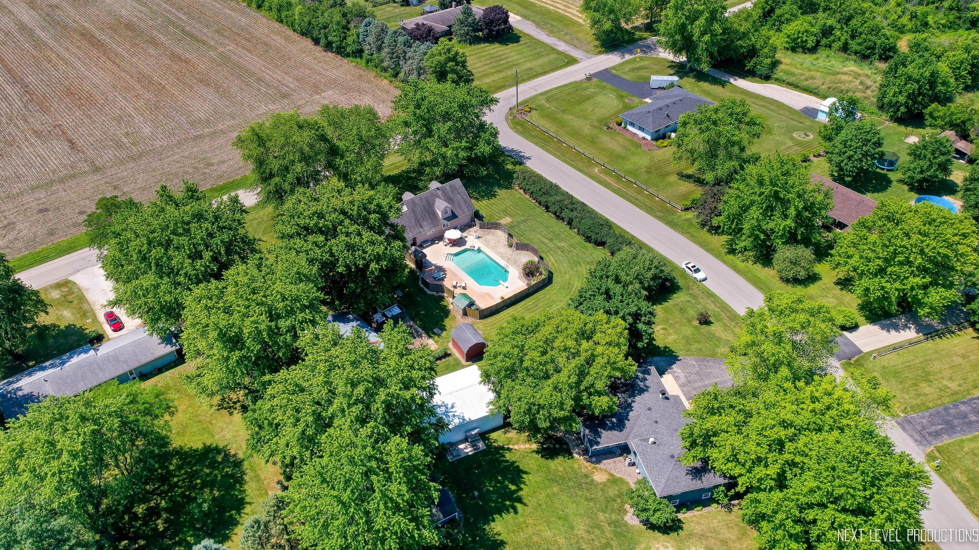 14815 Sears Road Plano, IL 60545 - Photo 13 of 30 an aerial view of a house a garden and swimming pool