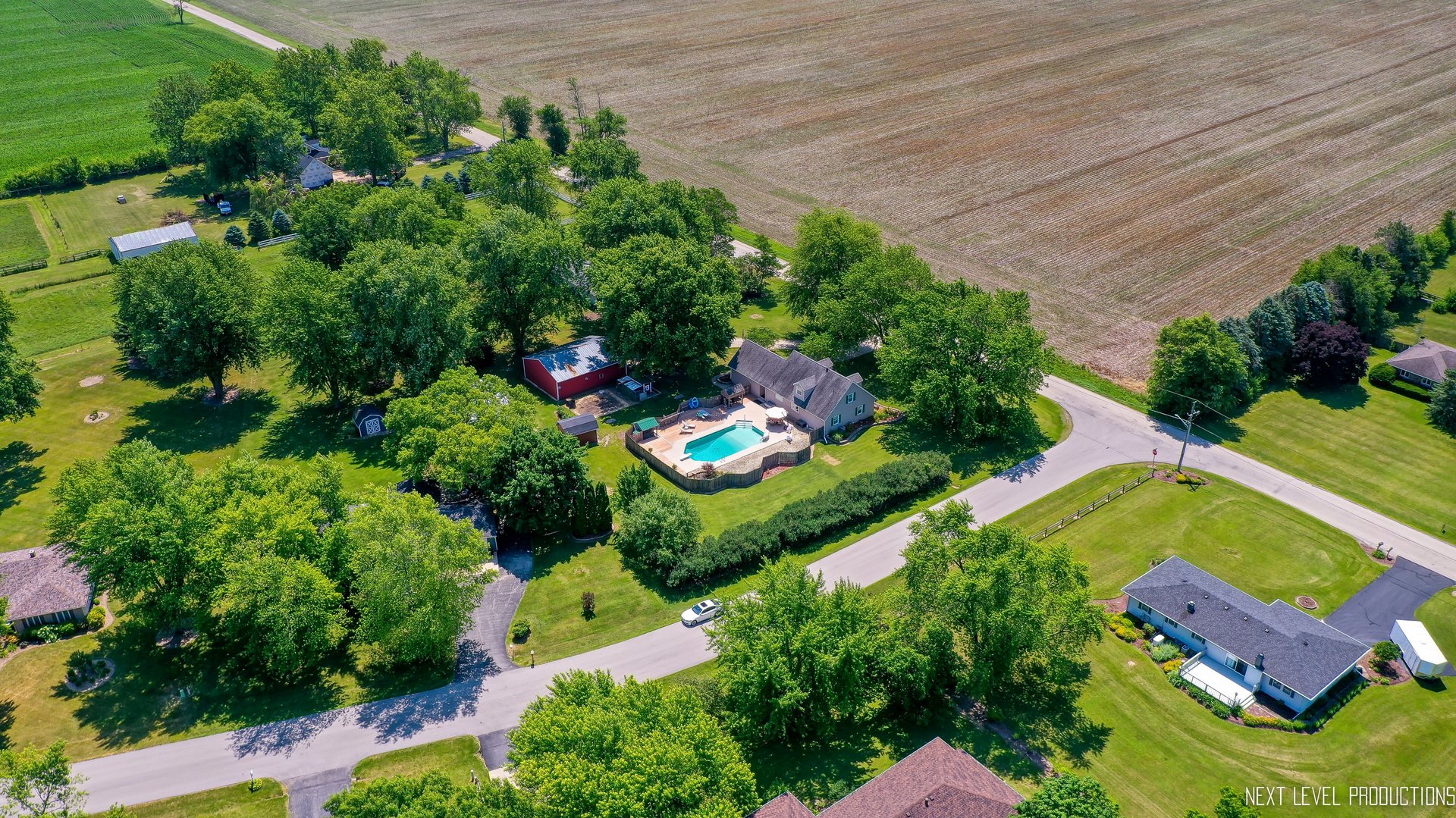14815 Sears Road Plano, IL 60545 - Photo 14 of 30 an aerial view of a house with a yard and greenery space