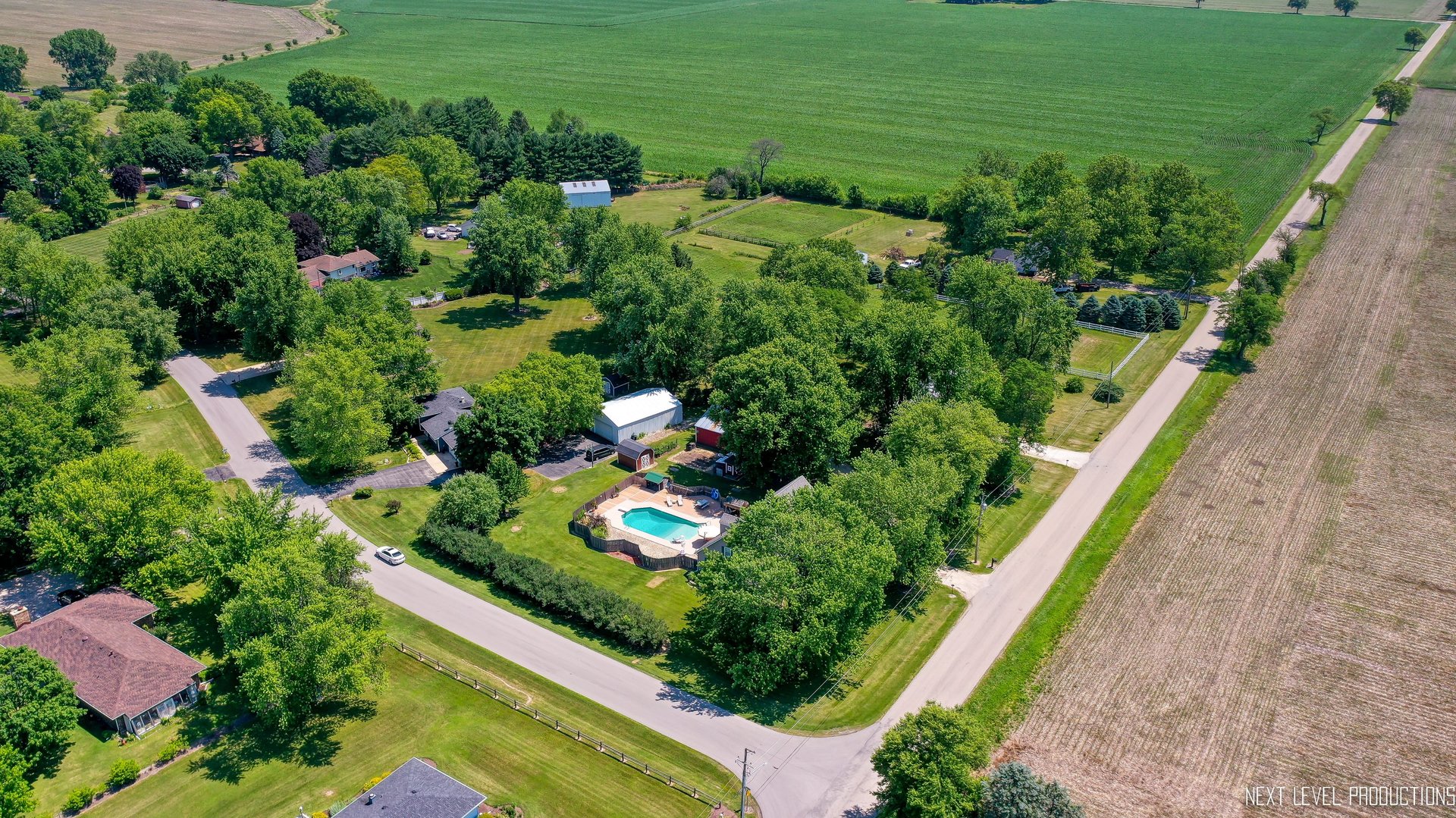 14815 Sears Road Plano, IL 60545 - Photo 15 of 30 a view of a garden with a lake