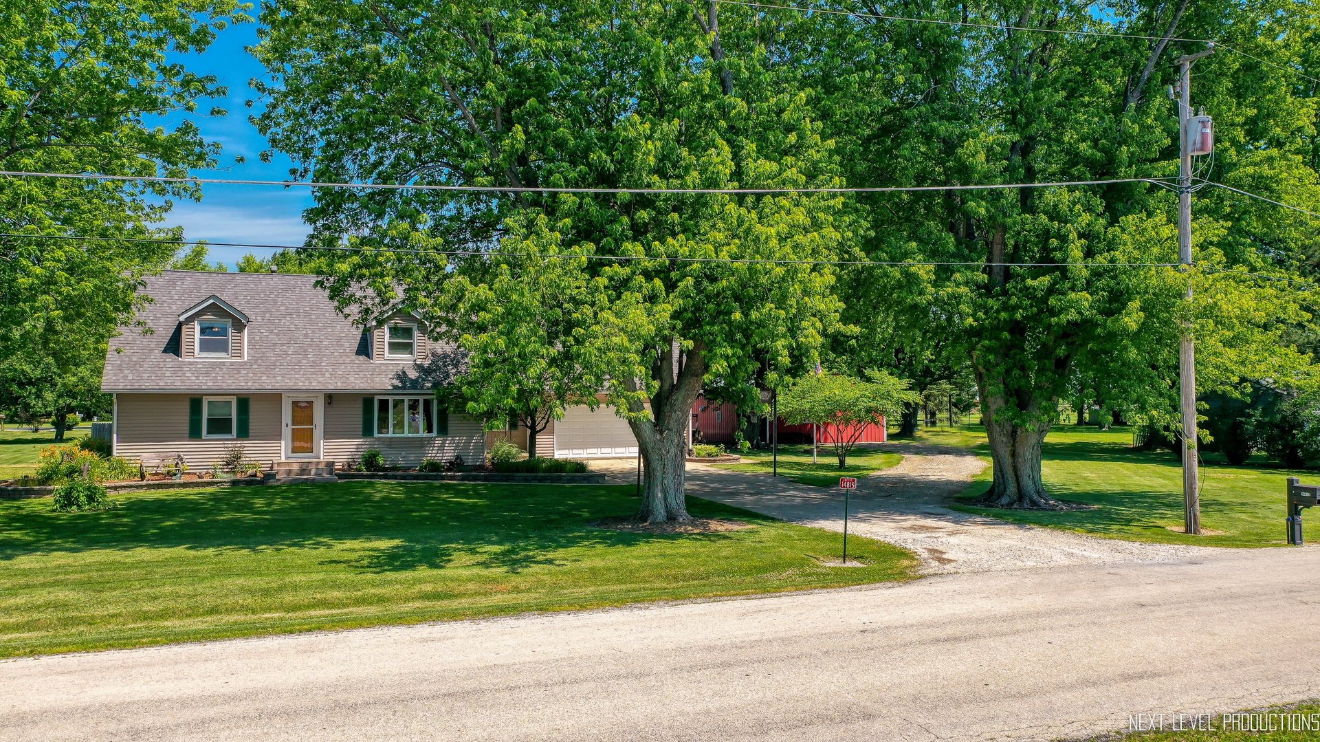 14815 Sears Road Plano, IL 60545 - Photo 16 of 30 a front view of a house with garden
