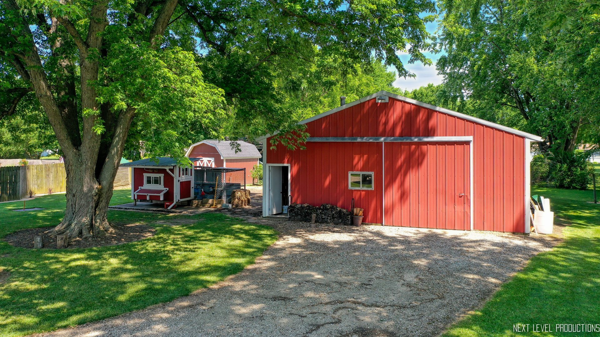 14815 Sears Road Plano, IL 60545 - Photo 17 of 30 a view of a barn in the middle of a yard