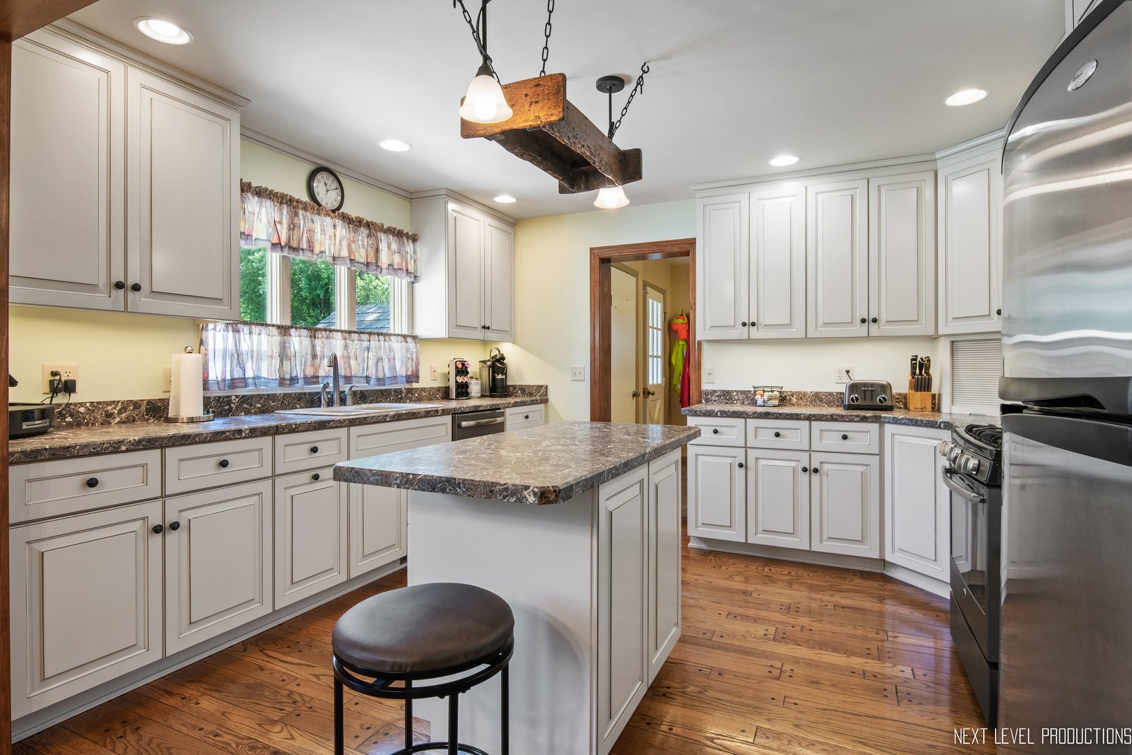 14815 Sears Road Plano, IL 60545 - Photo 20 of 30 a kitchen with stainless steel appliances granite countertop a sink a stove and a refrigerator