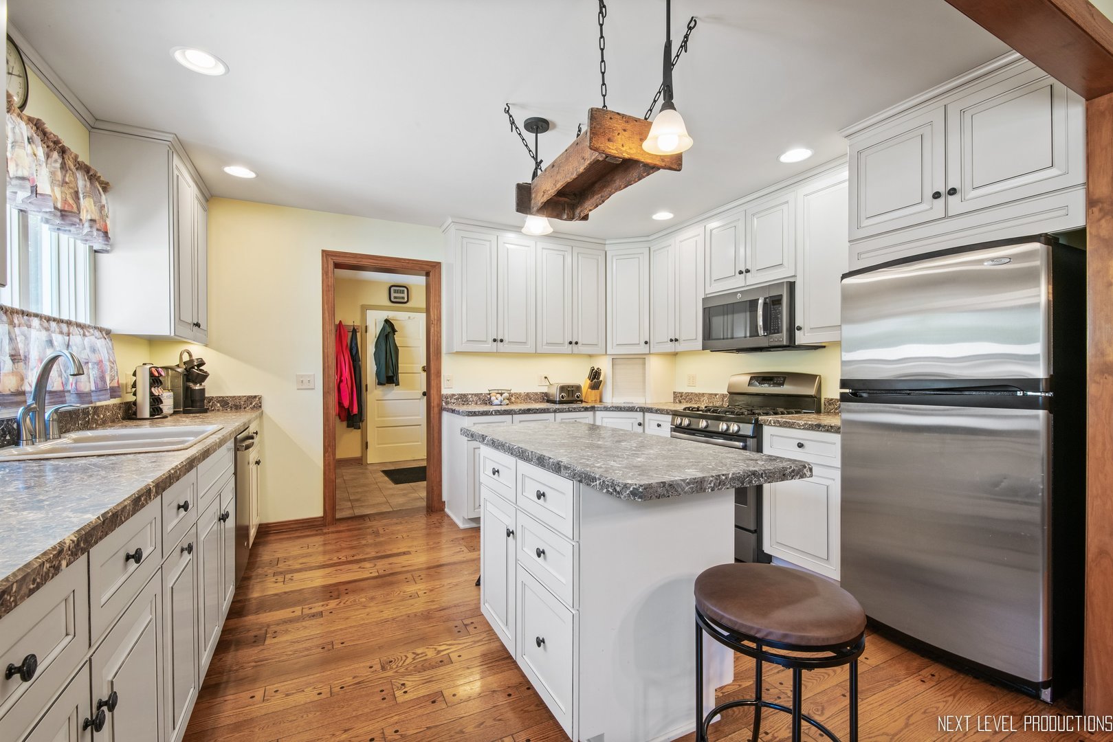 14815 Sears Road Plano, IL 60545 - Photo 21 of 30 a kitchen with stainless steel appliances granite countertop a sink stove and refrigerator