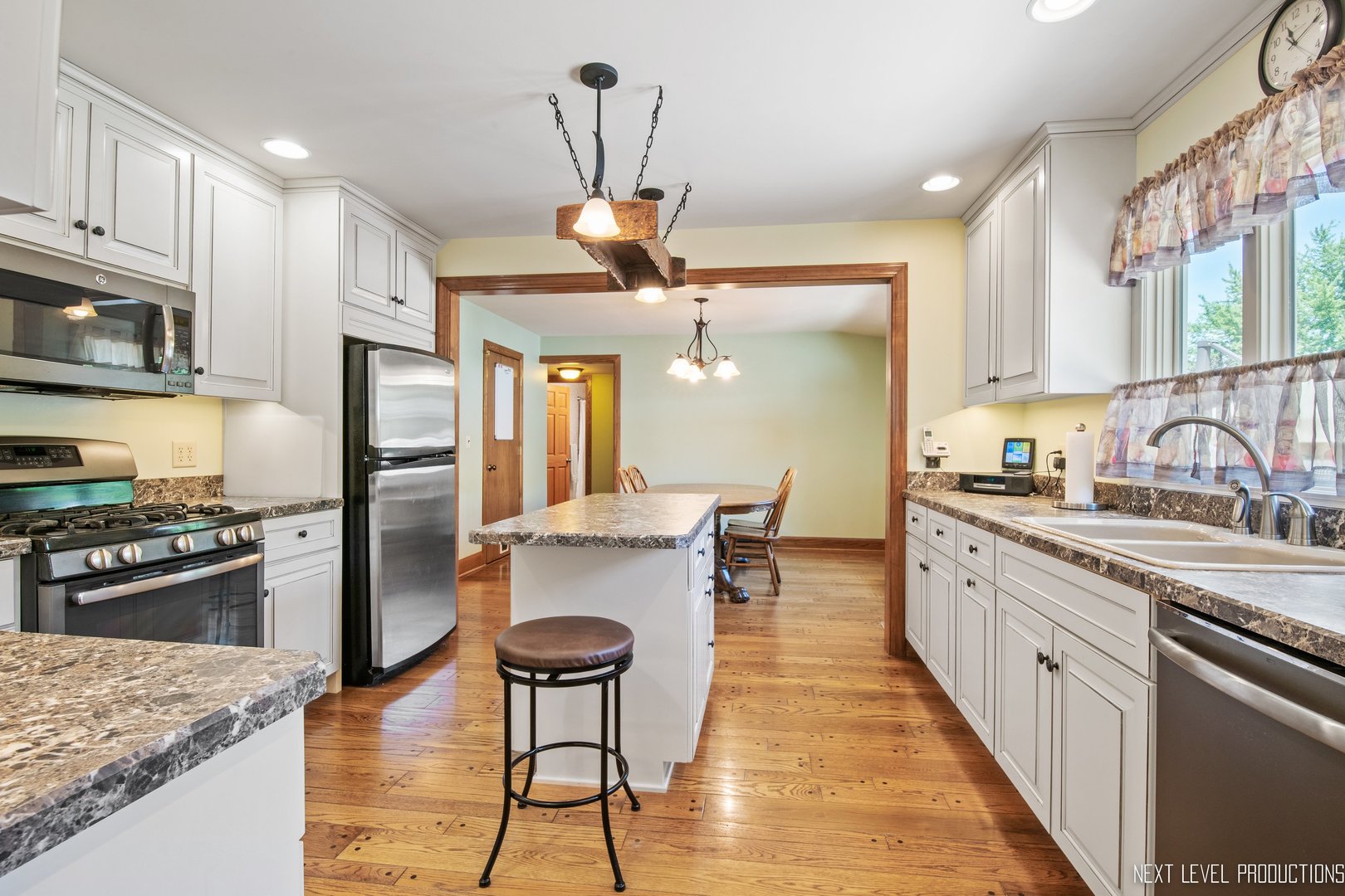 14815 Sears Road Plano, IL 60545 - Photo 22 of 30 a kitchen with stainless steel appliances granite countertop a sink stove and refrigerator