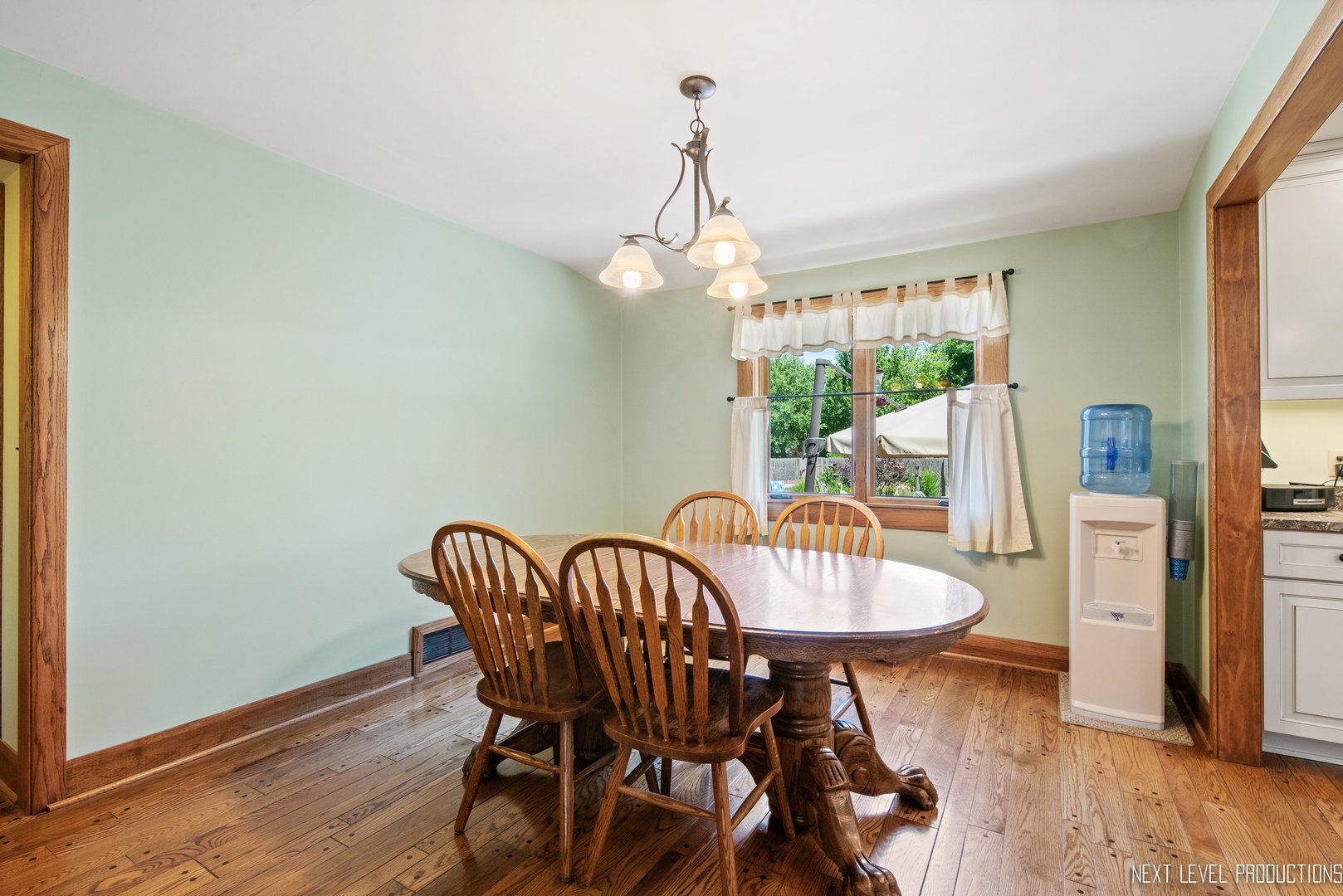 14815 Sears Road Plano, IL 60545 - Photo 23 of 30 a view of a dining room with furniture window and wooden floor