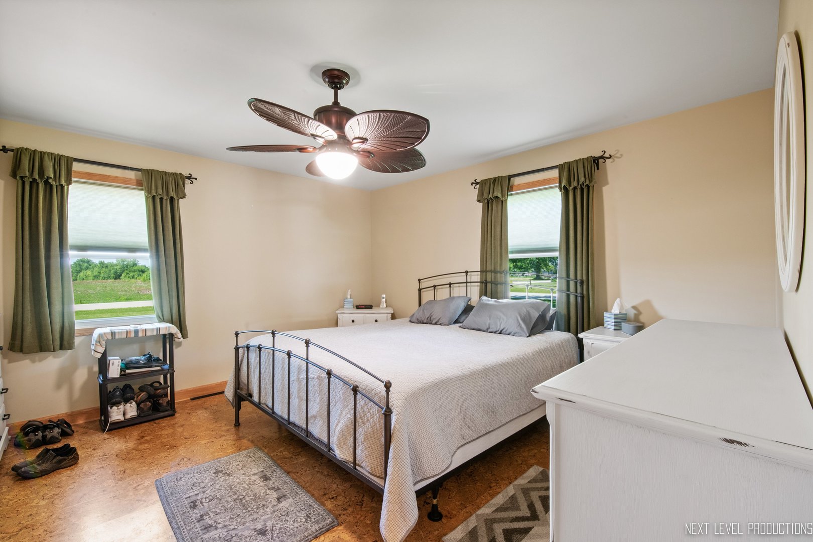 14815 Sears Road Plano, IL 60545 - Photo 25 of 30 a bedroom with a bed and a chandelier