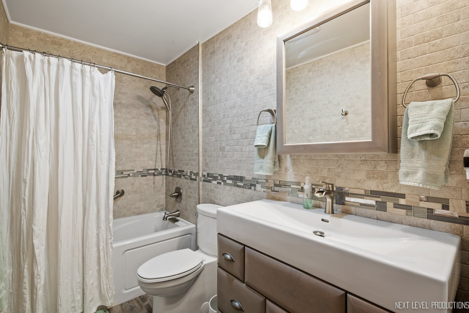 14815 Sears Road Plano, IL 60545 - Photo 26 of 30 a bathroom with a sink toilet mirror and shower