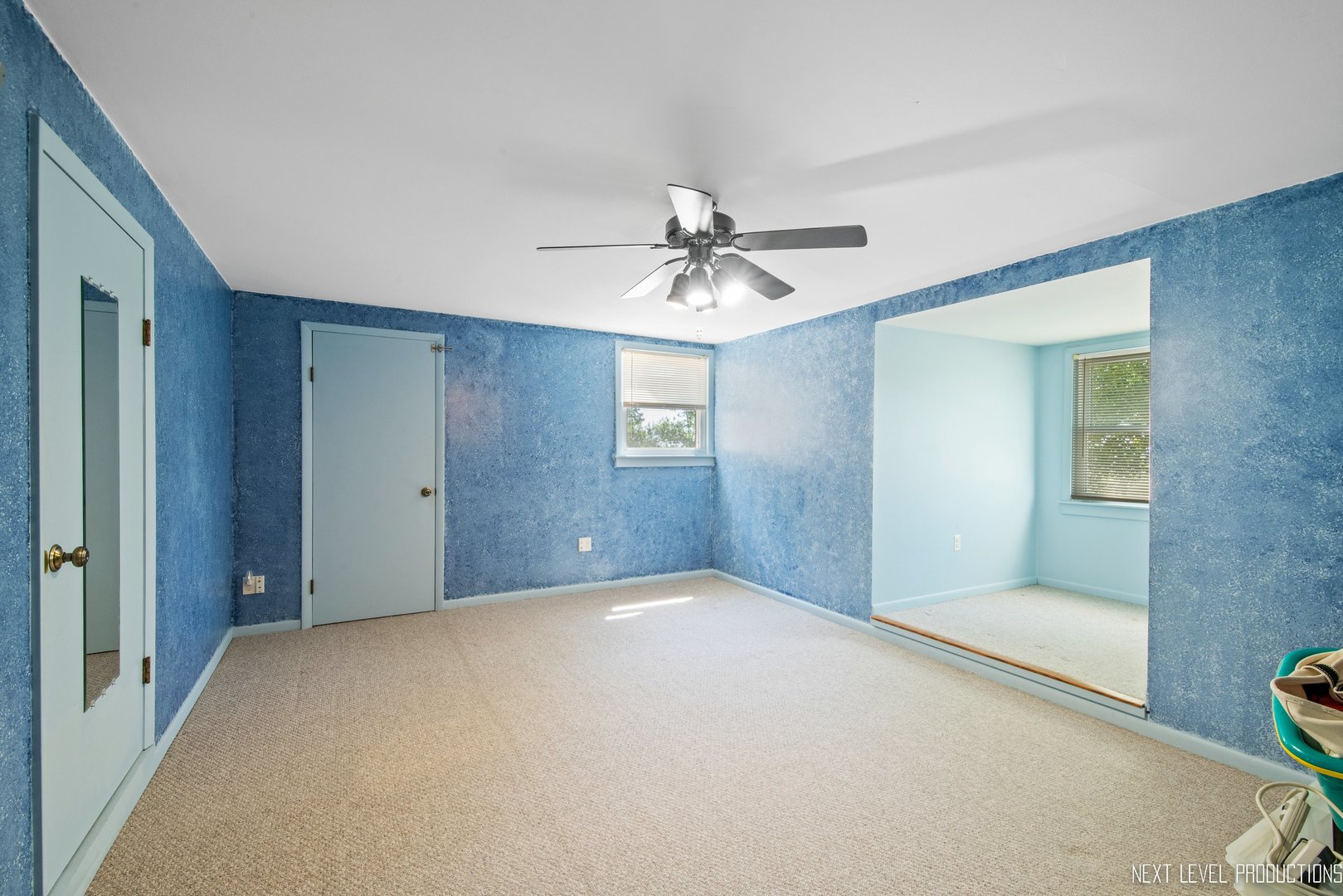 14815 Sears Road Plano, IL 60545 - Photo 27 of 30 a view of a hallway with a chandelier fan and a table