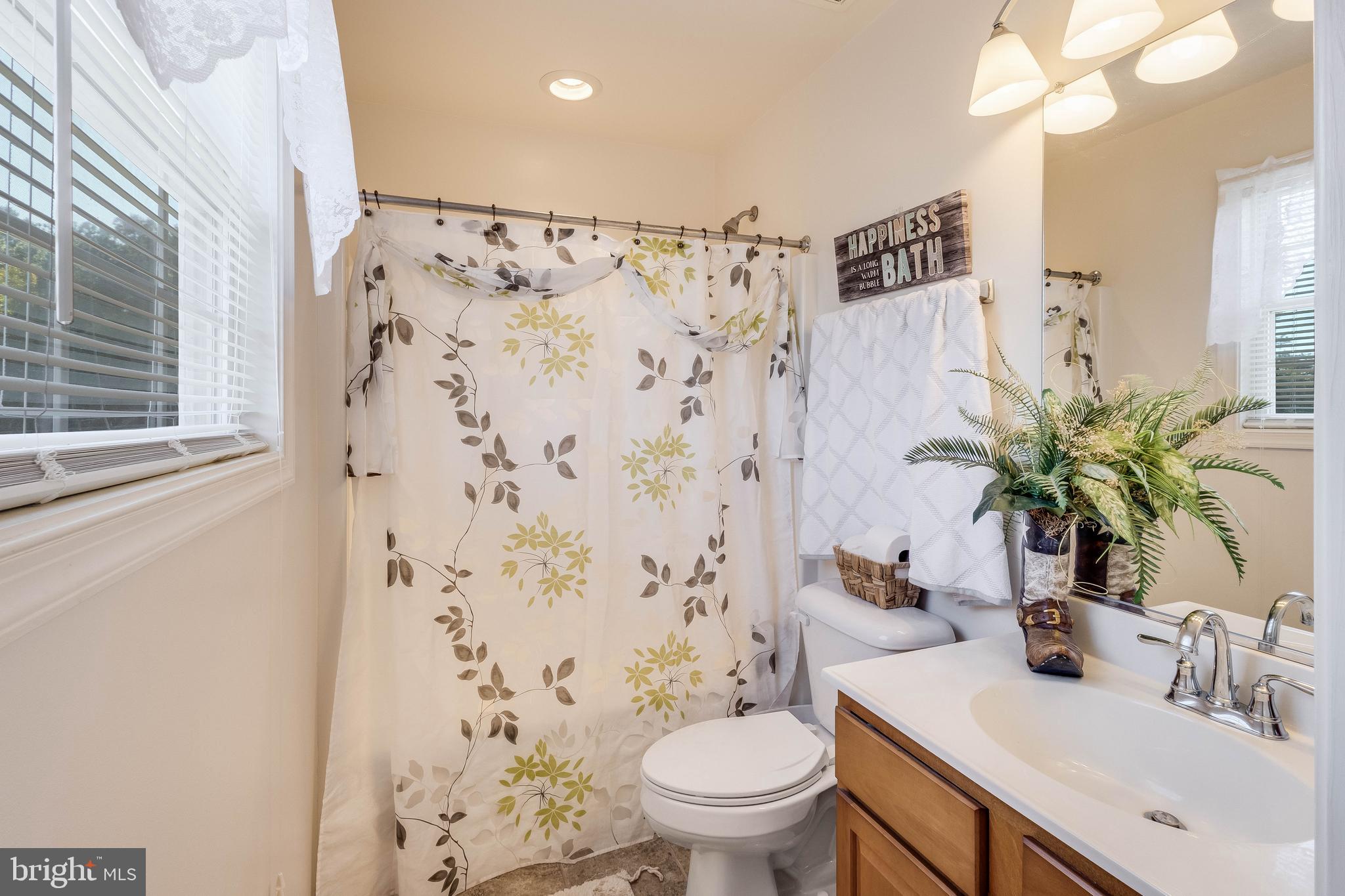 4757 Long Swamp Road Federalsburg, MD 21632 - Photo 14 of 47 a bathroom with a sink toilet and shower