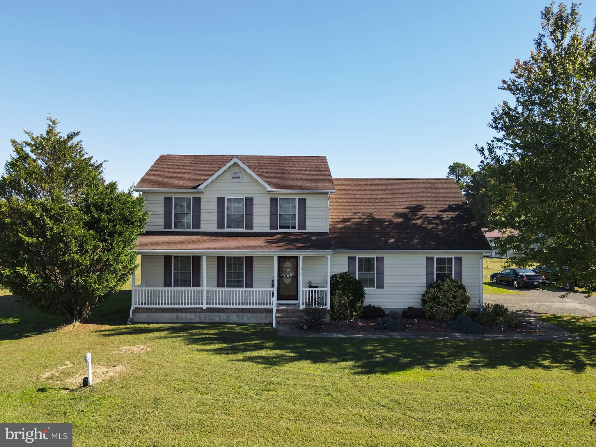 4757 Long Swamp Road Federalsburg, MD 21632 - Photo 2 of 47 a front view of a house with a yard table and chairs