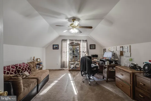 a workspace with furniture and chandelier