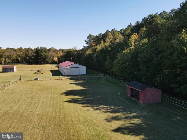 a view of a porch with furniture and a gate