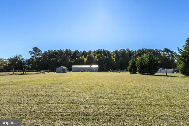 a balcony with table and chairs