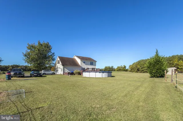 a view of a backyard with sitting area
