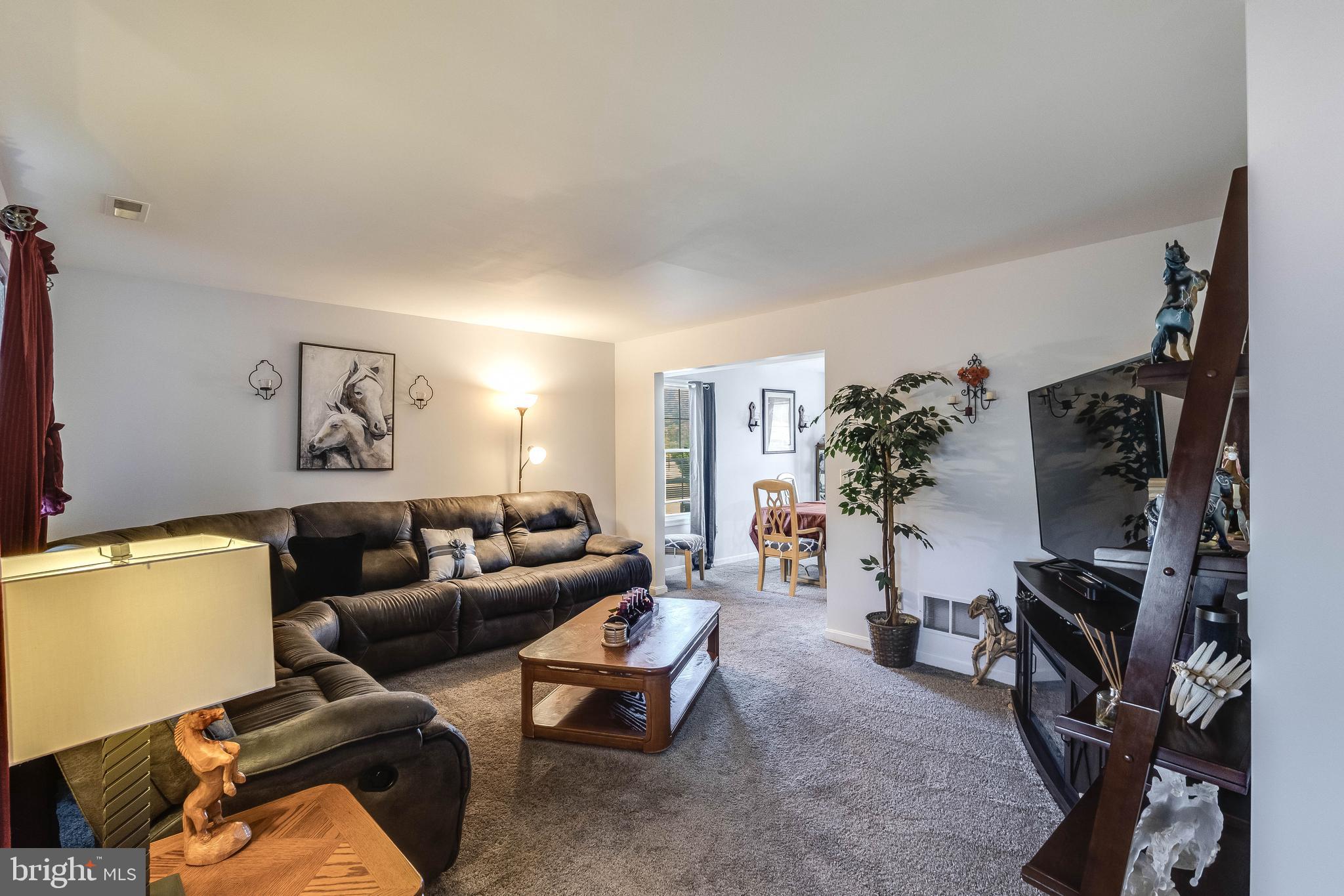 4757 Long Swamp Road Federalsburg, MD 21632 - Photo 4 of 47 a living room with furniture and a flat screen tv