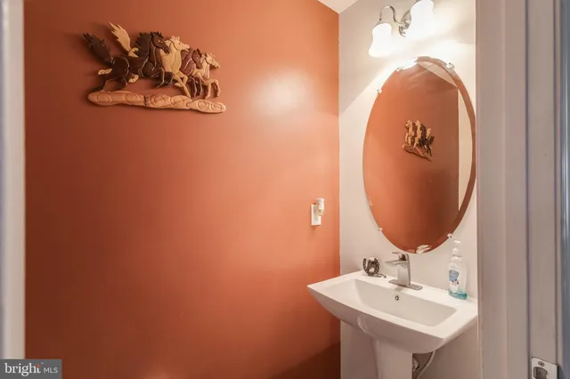 a bathroom with a sink and mirror