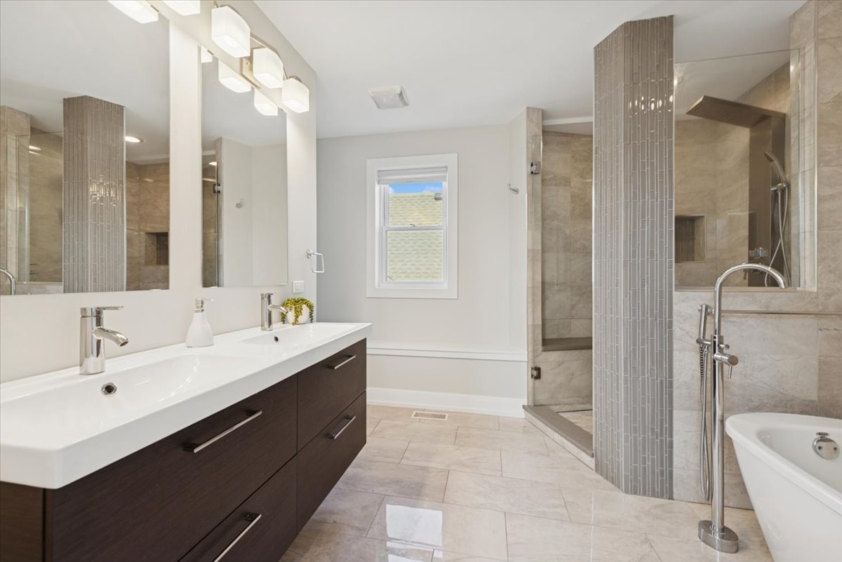 3254 North Rutherford Avenue Chicago, IL 60634 - Photo 18 of 29 a bathroom with a double vanity sink mirror and shower
