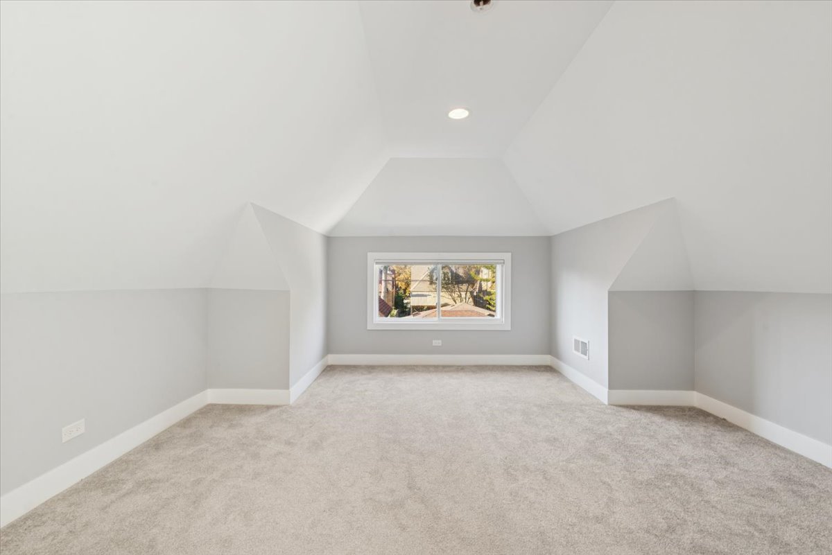 3254 North Rutherford Avenue Chicago, IL 60634 - Photo 20 of 29 an empty room with windows and painted walls