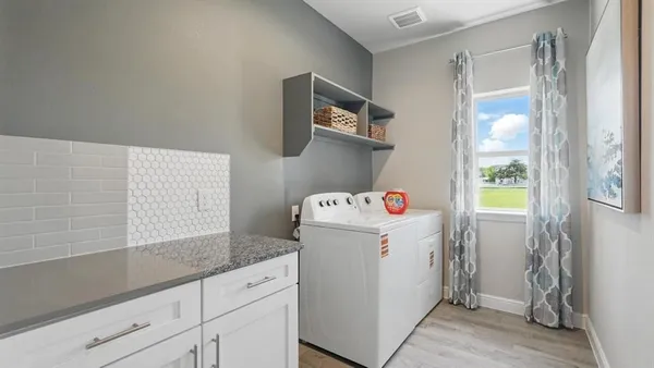 a utility room with dryer and washer
