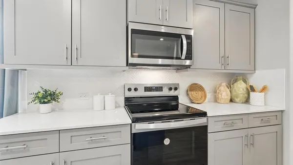 a kitchen with a stove and a microwave
